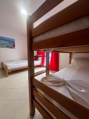 a bedroom with two bunk beds in a room at Hotel PEJA in Velipojë