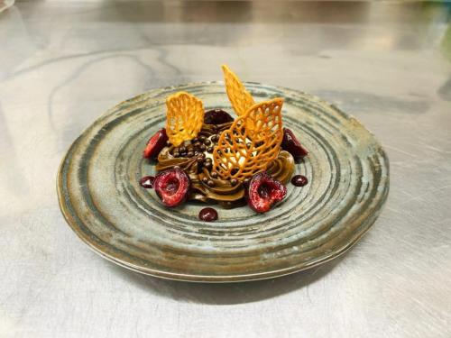 a plate of food with butterflies on it on a table at The Castle Coaching Inn in Trecastle