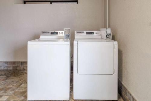 two refrigerators sitting next to each other in a room at Studio 6 Suites Brenham, TX in Brenham
