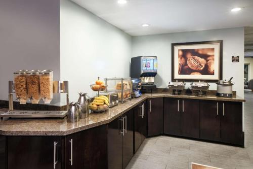 a kitchen with a counter with food on it at La Cuesta Inn, BW Signature Collection in San Luis Obispo