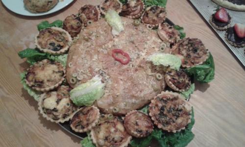 a plate of food with meat and mushrooms on a table at Hotel School Ersat Azrou in Azrou