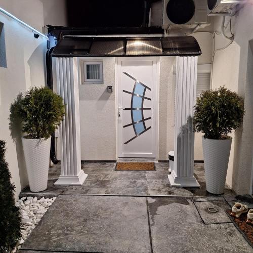 a white door with a painting on it at Jovanovic Residence Belgrad in Belgrade