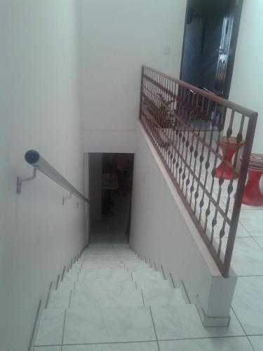 a stairway with a railing and a stair case at Pousada Jatobá in Barreirinhas