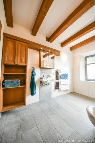 a bathroom with a sink and a toilet at Dreiurtshof in Remplin