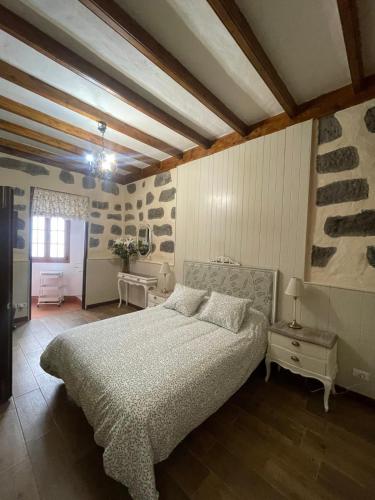 a bedroom with a large bed in a room at Casa La Candelaria - Moya in Moya