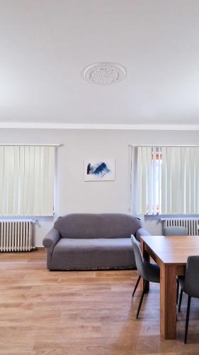 a living room with a couch and a table at Bardonecchia 3-room Apartment - Frejus Palace in Bardonecchia