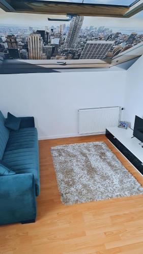 a living room with a couch and a view of a city at TEXAS in Timişoara
