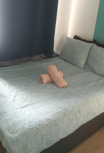 a brown towel laying on top of a bed at Private Studio Brussels Airport in Brussels