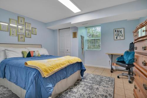 a bedroom with a bed and a desk and a chair at 1 BR Suite w Fenced Backyard - Parking! in Tucker