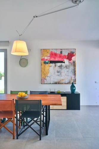 a dining room with a table and chairs at Villa Canepa in Marsala