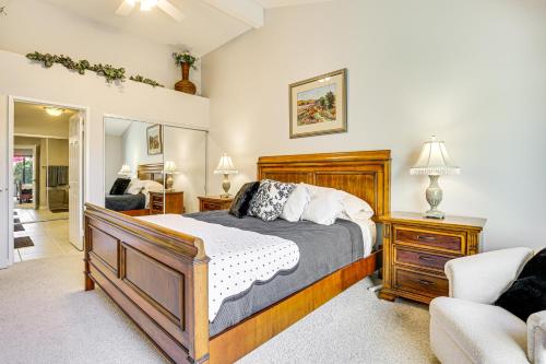 a bedroom with a bed and a living room at Community Pools and Golf Views Palm Desert Condo! in Palm Desert