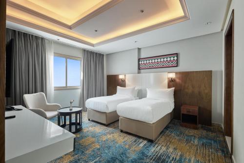 Ένα ή περισσότερα κρεβάτια σε δωμάτιο στο Nur Al Naseem by Makarem