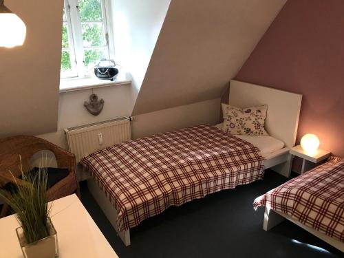 Postel nebo postele na pokoji v ubytování Scheune Nieblum