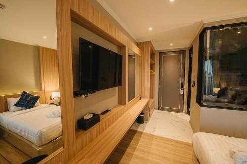 Carrara Hotel Hatyaiにあるベッド