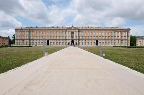 a large building with a long road in front at Novotel Caserta Sud in Caserta