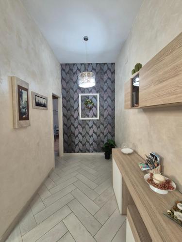 a kitchen with a counter and a tile floor at Tommy's Apartment in Pompei