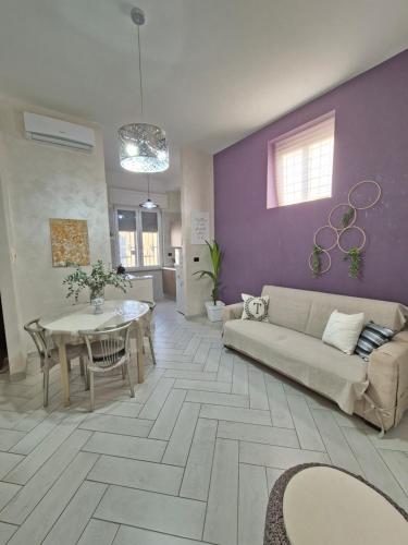 a living room with a couch and a table at Tommy's Apartment in Pompei