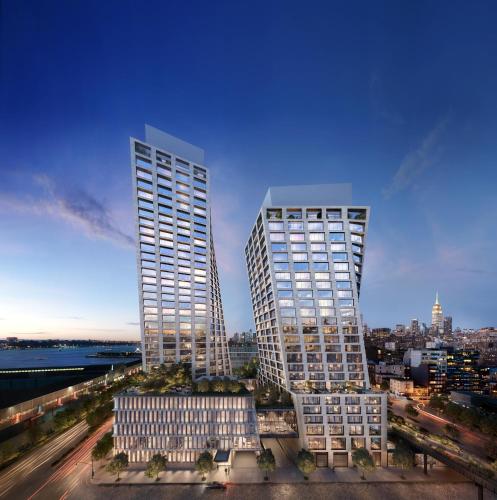 two tall skyscrapers in a city at dusk at Faena New York in New York