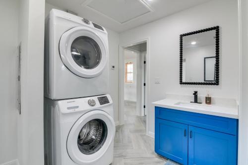 a laundry room with a washing machine and a sink at Balcony and Sunset Views Coastal Port Bolivar Gem in Port Bolivar