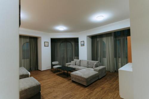 a living room with a couch and a table at Hotel Old Town in Batumi