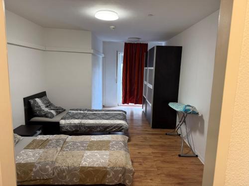 Ένα ή περισσότερα κρεβάτια σε δωμάτιο στο Bonn Appartments