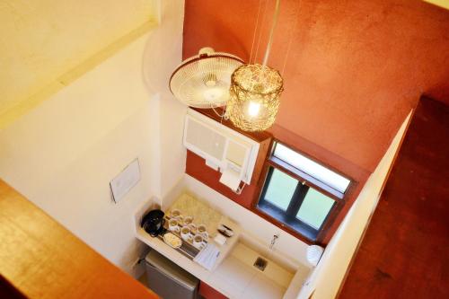 an overhead view of a small kitchen with a window at Agos Boracay Rooms + Beds in Boracay
