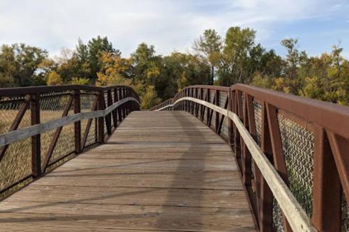 a wooden bridge over a body of water at Quiet Convenient Pvt Room in shared home Perfect for Travelers in Plymouth