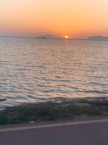 a sunset over a large body of water at MareSol in Marsala
