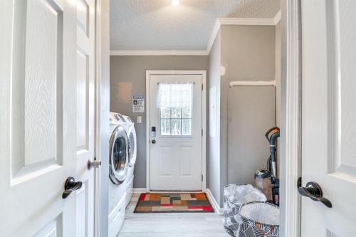 a laundry room with a washer and dryer at 8 Mi to Jordan Lake Spacious New Hill Home in Apex