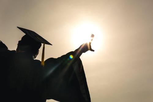 a man in a graduation hat with the sun at Staybridge Suites - Albuquerque Airport by IHG in Albuquerque