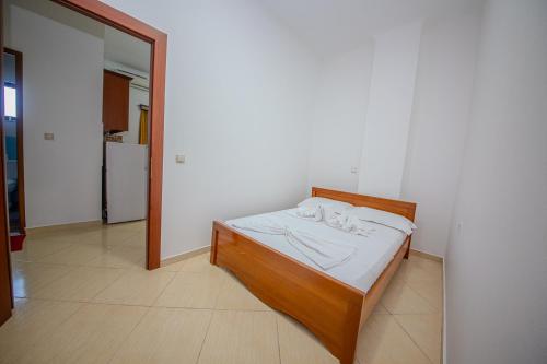 a bedroom with a bed in a room at Hotel Landi in Ksamil