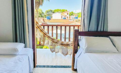 Postel nebo postele na pokoji v ubytování POUSADA SOL DE VERÃO - Cumuruxatiba -BA