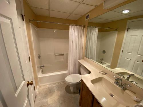 a bathroom with a sink and a toilet and a shower at Pico Village Resort D209 in Killington