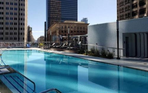 a large swimming pool on top of a building at Modern 3 Bedroom High-Rise with resort Pool in Los Angeles