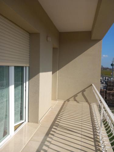 a balcony with a stair railing on a building at b&b il Melograno in Berlingo