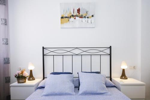 Postel nebo postele na pokoji v ubytování PINEDA BAHIA HomeStay by Turismar