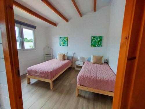 Giường trong phòng chung tại PuraVidaChiclana