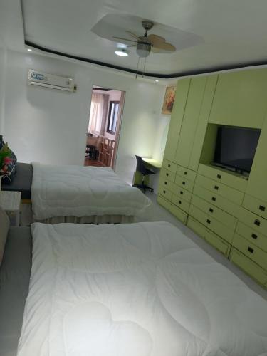 Katil atau katil-katil dalam bilik di Room Calapan