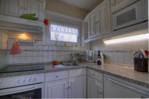 Køkken eller tekøkken på Strandgut - Bungalow am Meer