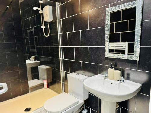 Koupelna v ubytování Quarto 6 casa compartilhada no L7