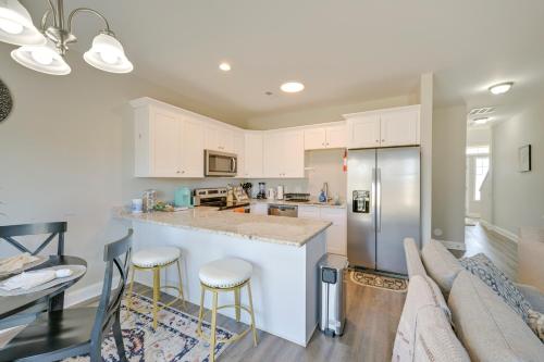a kitchen with white cabinets and a counter top at Stay and Play Spacious Concord Townhome Near Uptown in Concord