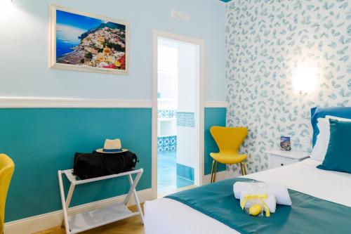 Postel nebo postele na pokoji v ubytování Sirenuse Home & Suites