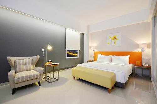 Кровать или кровати в номере TreePark Banjarmasin