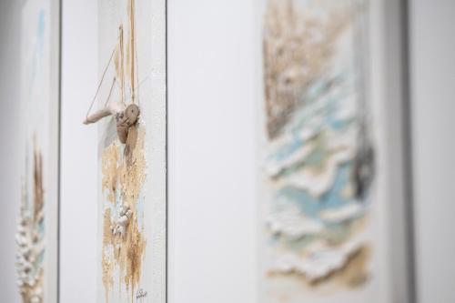 a bunch of dirt on a door with paintings at CHD Rooms in Ancona