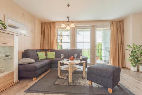 a living room with a couch and a table at Ferienhaus Teuber in Trassenheide