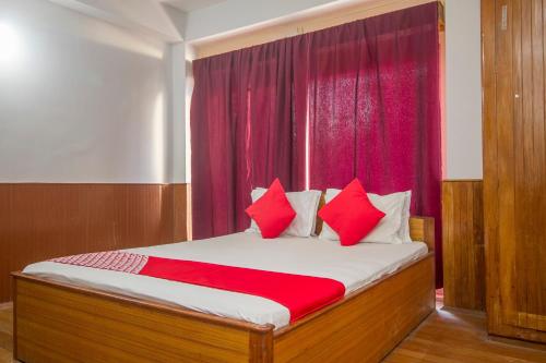 Ένα ή περισσότερα κρεβάτια σε δωμάτιο στο Hotel O Nourpem Residency