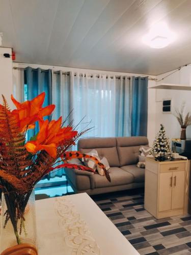 a living room with a couch and a table at Derichness in Tagbilaran City