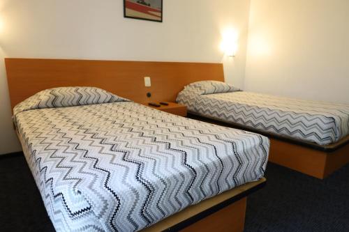 Postel nebo postele na pokoji v ubytování Aristos Express CDMX