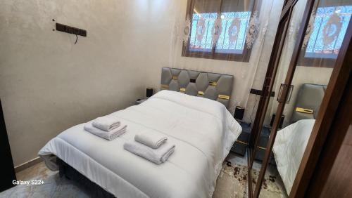 Postel nebo postele na pokoji v ubytování Appartement 7 min de l'aéroport de Marrakech