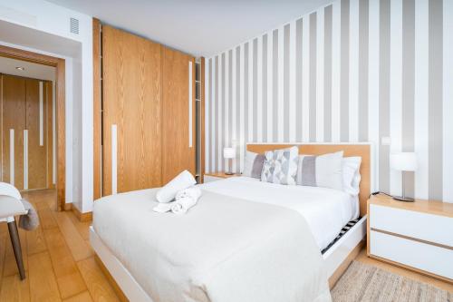 Ένα ή περισσότερα κρεβάτια σε δωμάτιο στο BeGuest Premium Lisbon Suites
